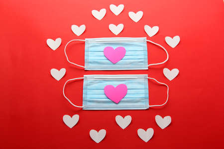 valentine in pandemic by covid-19, protection mask clinical use and heartsの写真素材