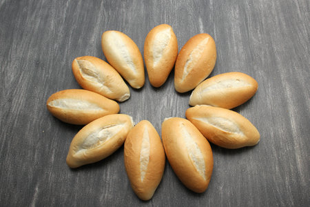 Delicious, fluffy, hot, crispy Mexican bread, bolillo white bread, loaf or French bread made with...