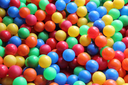 Pool of colored balls for children and babies to play and have fun at parties or at home. Concept of...
