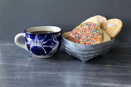 Talavera mug with coffee and Mexican sweet bread bakeryの写真素材