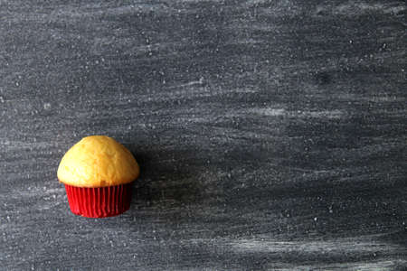 Mexican sweet bread on vintage gray table. Shell, concha, cupcake, shortbread, bow tie, mustache, ear, chochos, biscuit with multicolored twigsの写真素材