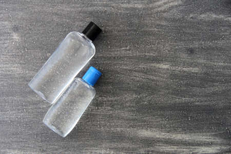 Antibacterial alcohol disinfectant gel 2 presentations on vintage gray background, covid preventionの写真素材