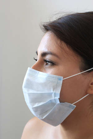 latin woman with protection mask clinical use for pandemic covid-19