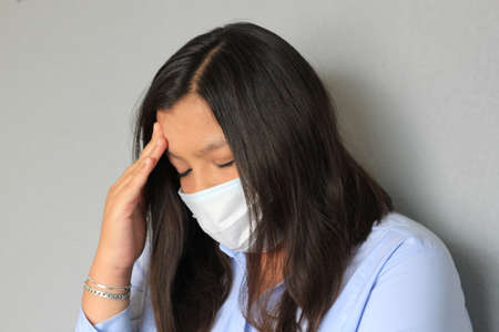 Latin woman with blue blouse and protection mask clinical use for covid pandemic