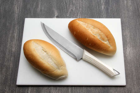 Fresh, delicious, freshly made Mexican bolillo bread, French bread, loaf, white bread on a white...