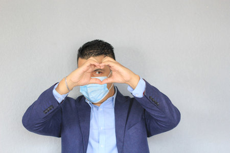Formal adult latin man with protection mask, new normal covid-19の写真素材