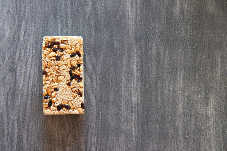 Alegrias, typical Mexican candy made of natural amaranth and chocolate and vintage gray wooden backgroundの写真素材