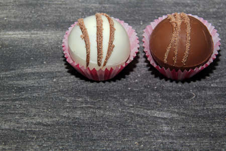 marshmallow filled chocolate bombs, white chocolate on vintage gray backgroundの写真素材