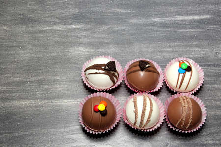 marshmallow filled chocolate bombs, white chocolate on vintage gray backgroundの写真素材