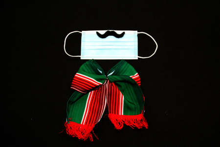 Festive items for the Mexican Independence party say Viva Mexico: pennants, pinwheels, tricolor tie...