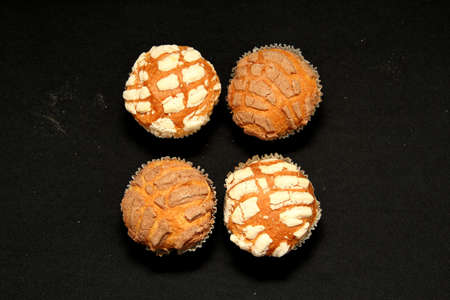 Mexican sweet bread Manteconchas vanilla and chocolate flavor cupcake type made with butter that is...
