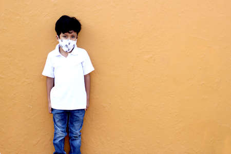 6-year-old Latino boy wearing a face mask for the new normalの写真素材