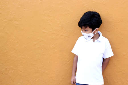 6-year-old Latino boy wearing a face mask for the new normalの写真素材
