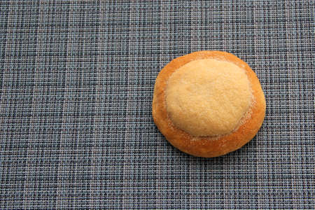 Freshly made Ojo de Pancha or Ox bread from Mexican cuisine in a basket, or napkin accompanied by...