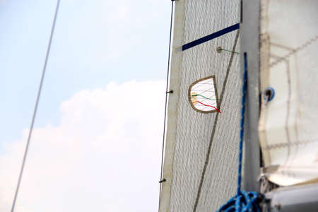 Parts of a sailboat that is sailing on the lake with sails out, bow, stern, sheet, mast, rudder,...