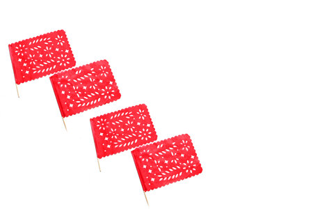 Mexican party pennants handmade red cut-out paper like the flag of Mexico to celebrate the national...