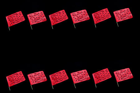 Mexican party pennants handmade red cut-out paper like the flag of Mexico to celebrate the national...