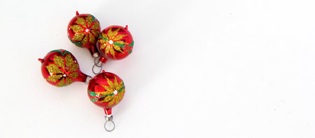 Red Christmas balls with good night design on white background with star