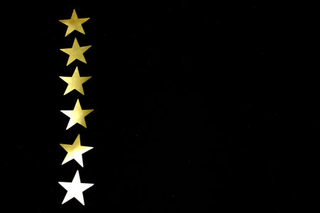 Sparkling stars as decorated frame for Christmas messages with poinsettia flowers and pinwheelsの写真素材