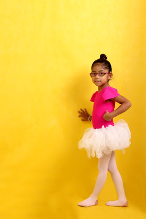 4-year-old brunette Latina girl with autism spectrum disorder (ASD) takes ballet dance therapy to express herself and communicateの写真素材