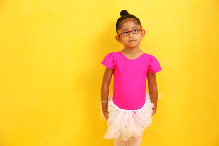 4-year-old brunette Latina girl with autism spectrum disorder (ASD) takes ballet dance therapy to express herself and communicateの写真素材