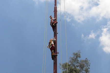 Mexico City, Mexico - August 2, 2023: The ritual ceremony of the Voladores de Papantla is a dance associated with fertility that they perform in Veracruzのeditorial素材