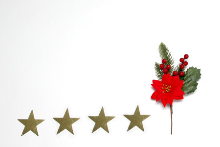 Sparkling stars as decorated frame for Christmas messages with poinsettia flowers and pinwheels