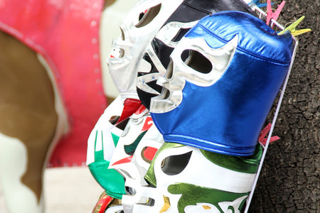 Mexico City, Mexico - August 23, 2023: Street stall selling masks of famous wrestlers from Mexican wrestling as souvenirsのeditorial素材