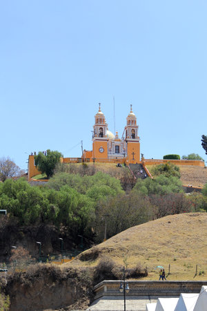 Cholula, Puebla, Mexico - Mar 16 2024: The Great Pyramid Tlachihualtepetl is the largest in the world and at the top is the Church of Our Lady of Remediesのeditorial素材