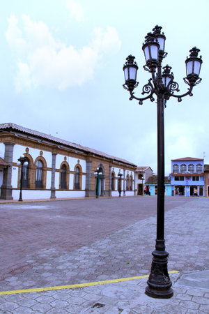 Chignahuapan Puebla, Mexico - Sep 7 2014: Plaza de Armas with a colorful wooden kiosk and the Parroquia de Santiago Apostol church, with its brightly colored facadeのeditorial素材