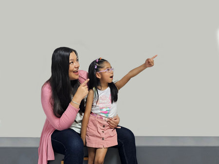 Divorced single mom with her 5 year old brunette Latina daughter spending quality time, happy,...