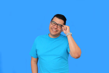 A 40-year-old dark-skinned Latino man uses eyeglasses to see better because he suffers from myopia...