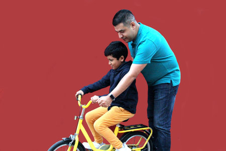 Divorced Single Dad Teaches His 9-Year-Old Brown Latino Son How to Ride a Bike as a Father-Son...