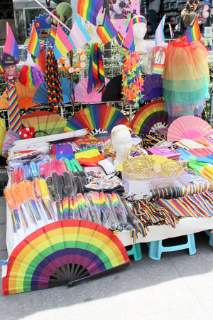 Mexico City, Mexico - Jun 12 2024: Street stall sells products with the gay rainbow flag for the march during pride monthのeditorial素材