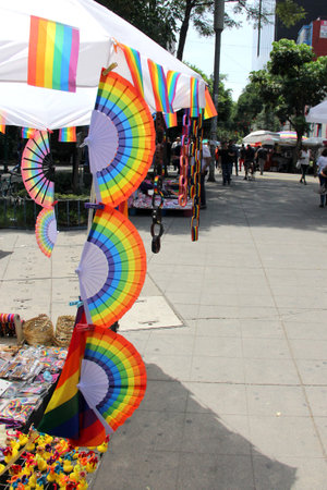 Mexico City, Mexico - Jun 12 2024: Street stall sells products with the gay rainbow flag for the march during pride monthのeditorial素材