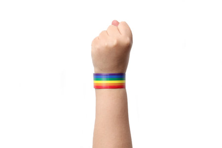 Hand with bracelet with the rainbow colors of the gay flag, a symbol that represents the LGBTQ+...