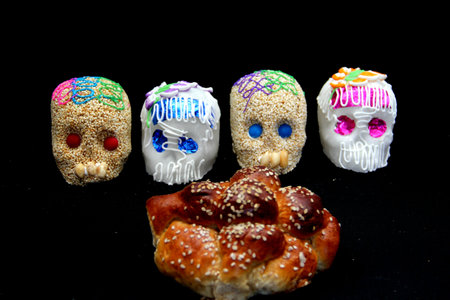 Candy in the shape of a skull made of sugar and amaranth to decorate the offering with candles for...