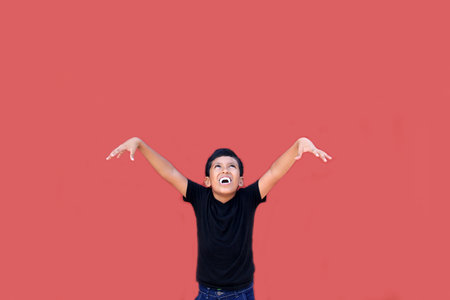 9-year-old dark-skinned Latino boy uses false vampire teeth to scare and celebrate Halloween and Day...