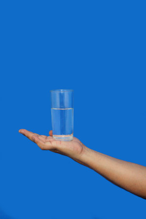 Consumption of water provides benefits such as the absorption of nutrients, lubricating the joints, eliminating toxins, facilitating blood flow and improving digestive functionの写真素材