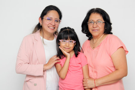 Brunette Latina grandmother, mom and daughter with glasses show their love and support together and...