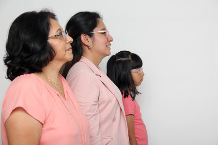 Family of grandmother, mother and daughter see with surprise and enthusiasm that they are excited to buyの写真素材