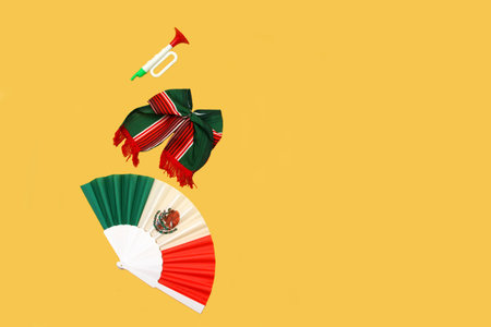 Tricolor party items to celebrate the Mexican national holidays: fan, bow, pinwheels, trumpet for...
