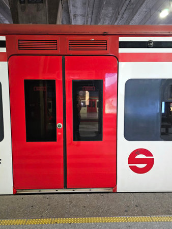 Mexico City, Mexico - Nov 20 2024: Red and white cars of the Suburban Railway of the Metropolitan Zone of the Valley of Mexico on the station tracksのeditorial素材