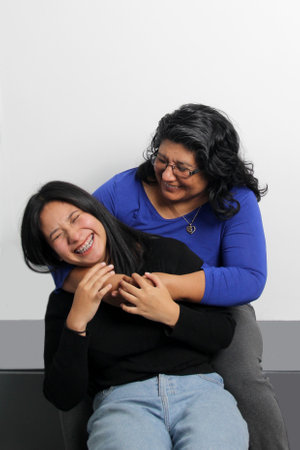 Single mom and brunette Latina college daughter show their unconditional love and support to...