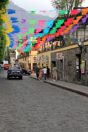 Tepoztlan, Morelos, Mexico - Nov 7 2024: Cobbled streets of the magical town Tepoztlan in Morelos, Mexico, a place of rest, mystical and warm climateのeditorial素材