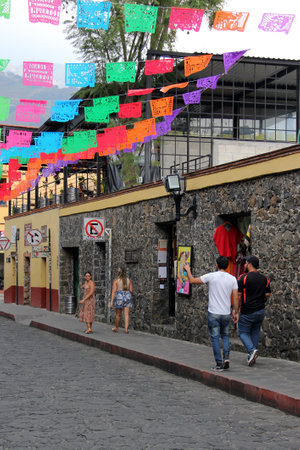 Tepoztlan, Morelos, Mexico - Nov 7 2024: Cobbled streets of the magical town Tepoztlan in Morelos, Mexico, a place of rest, mystical and warm climateのeditorial素材