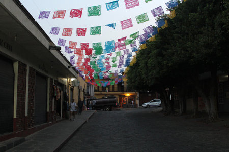 Tepoztlan, Morelos, Mexico - Nov 7 2024: Cobbled streets of the magical town Tepoztlan in Morelos, Mexico, a place of rest, mystical and warm climateのeditorial素材