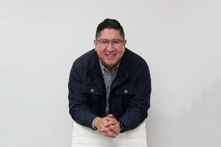 30-year-old Latino man with glasses is proud to be a successful business entrepreneurの写真素材