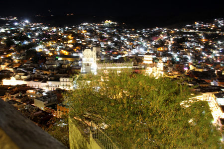 Night view of the city of Guanajuato in Mexico from the viewpoint where you can see the downtown, the university and the Basilicaの写真素材