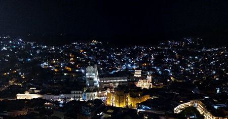 Night view of the city of Guanajuato in Mexico from the viewpoint where you can see the downtown, the university and the Basilicaの写真素材